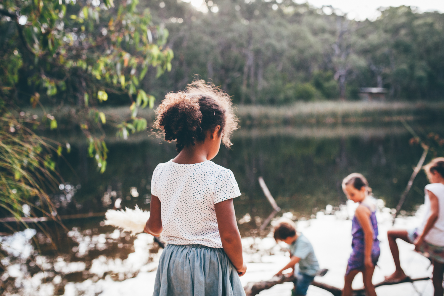 Children play by the water